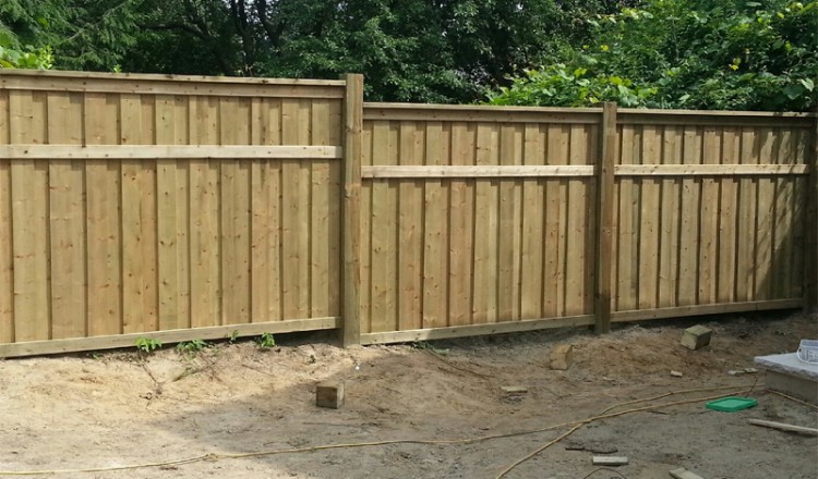 wood fence installation in residential area